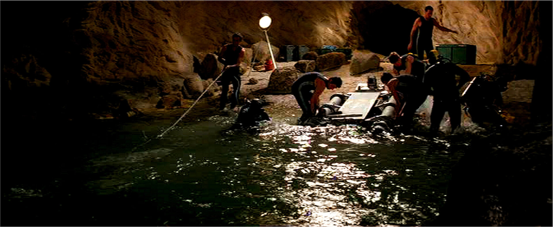 Largo's Sub-marine Sled arrives at subterranean Cavern.