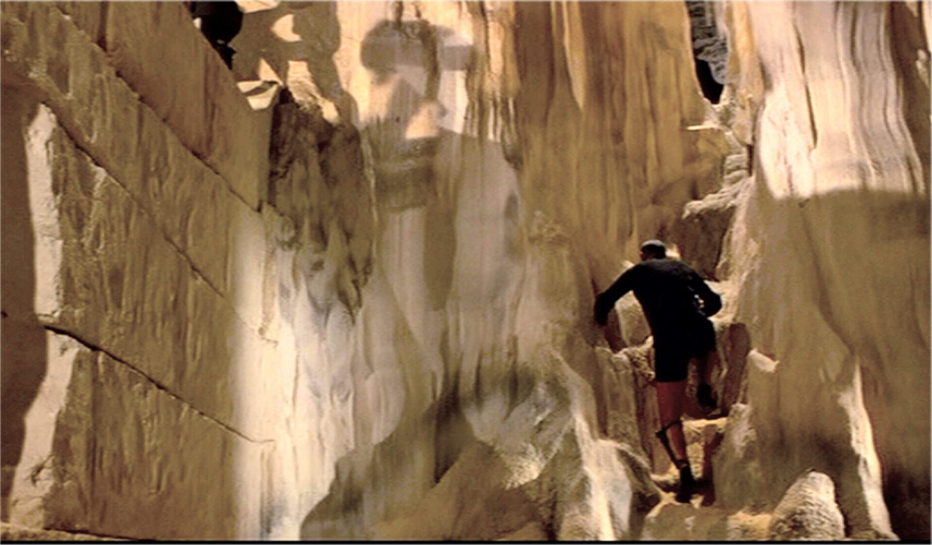 Bond pursues Largo into the subterranean temple 'The Tears of Allah'.